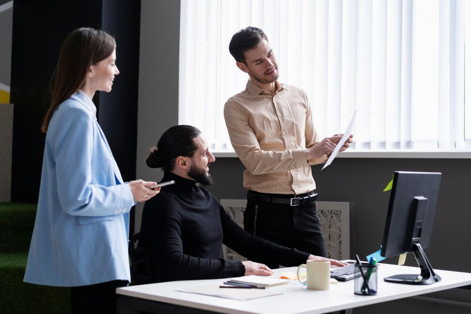 Professional workspace showing budget planning materials and laptop