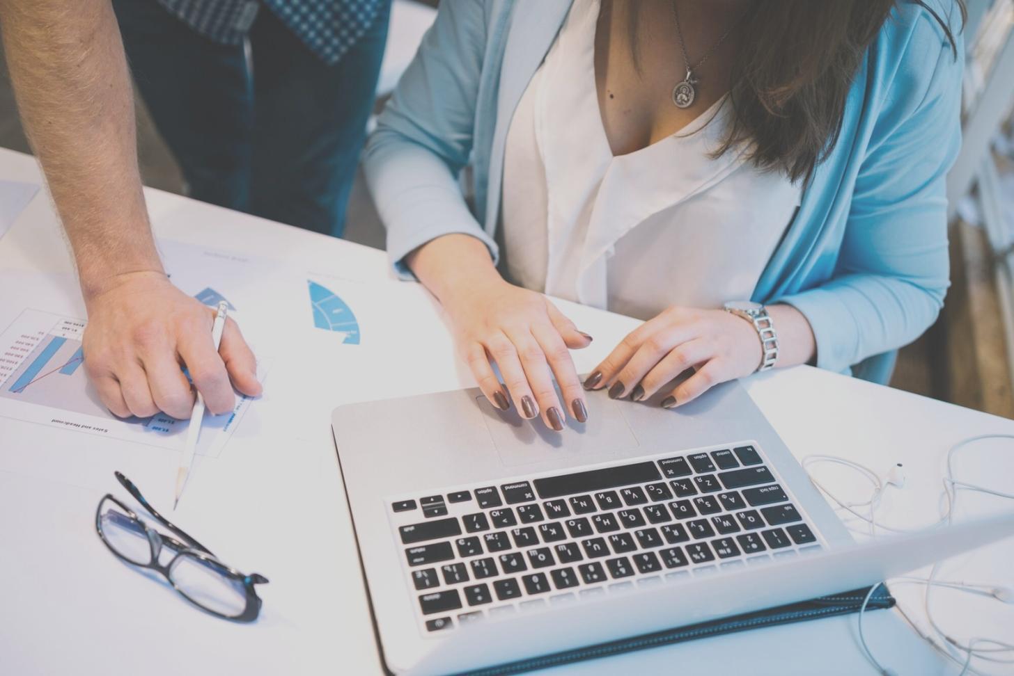 Financial planning workspace showing organized documents and calculator for budget preparation